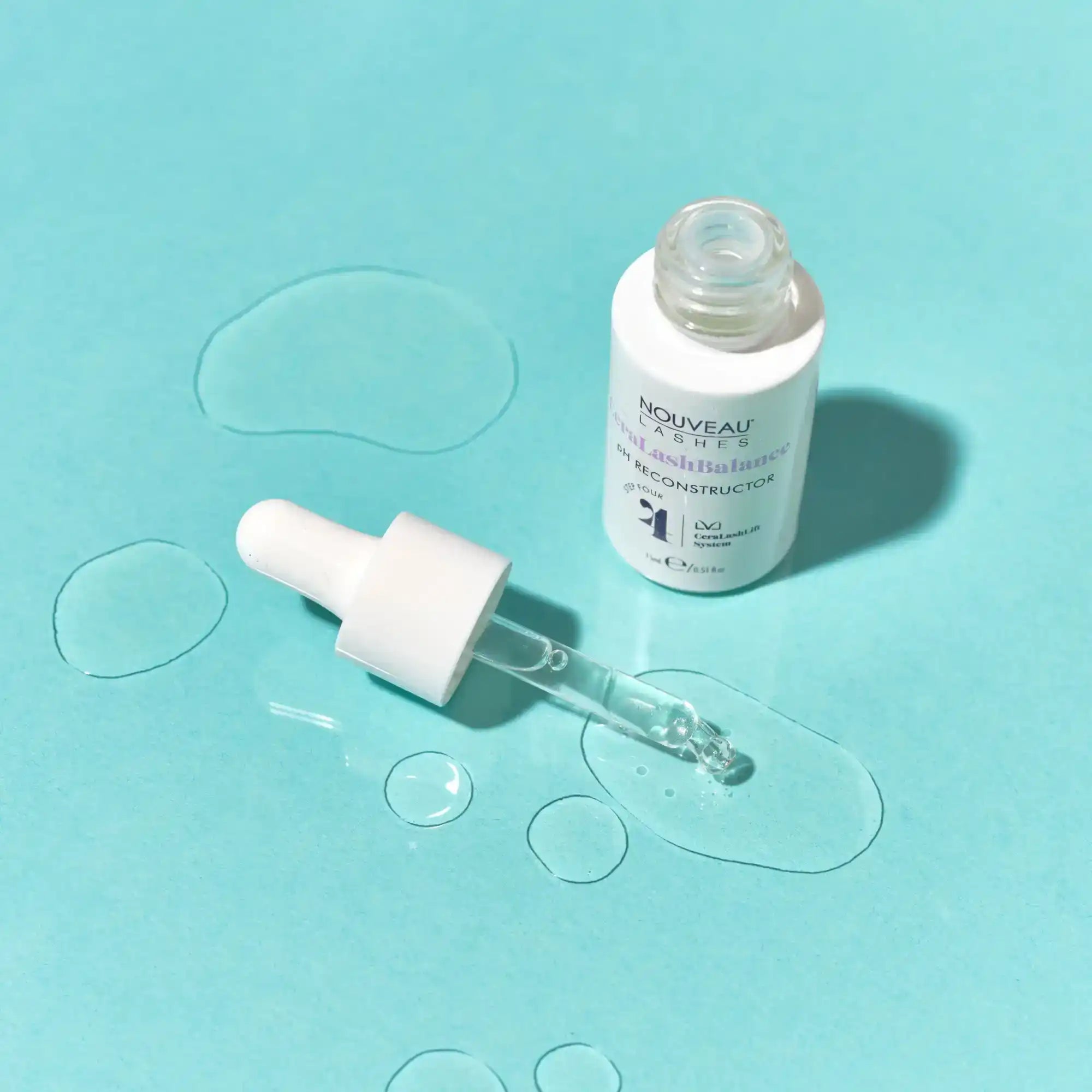 White bottle of lash serum with dropper.