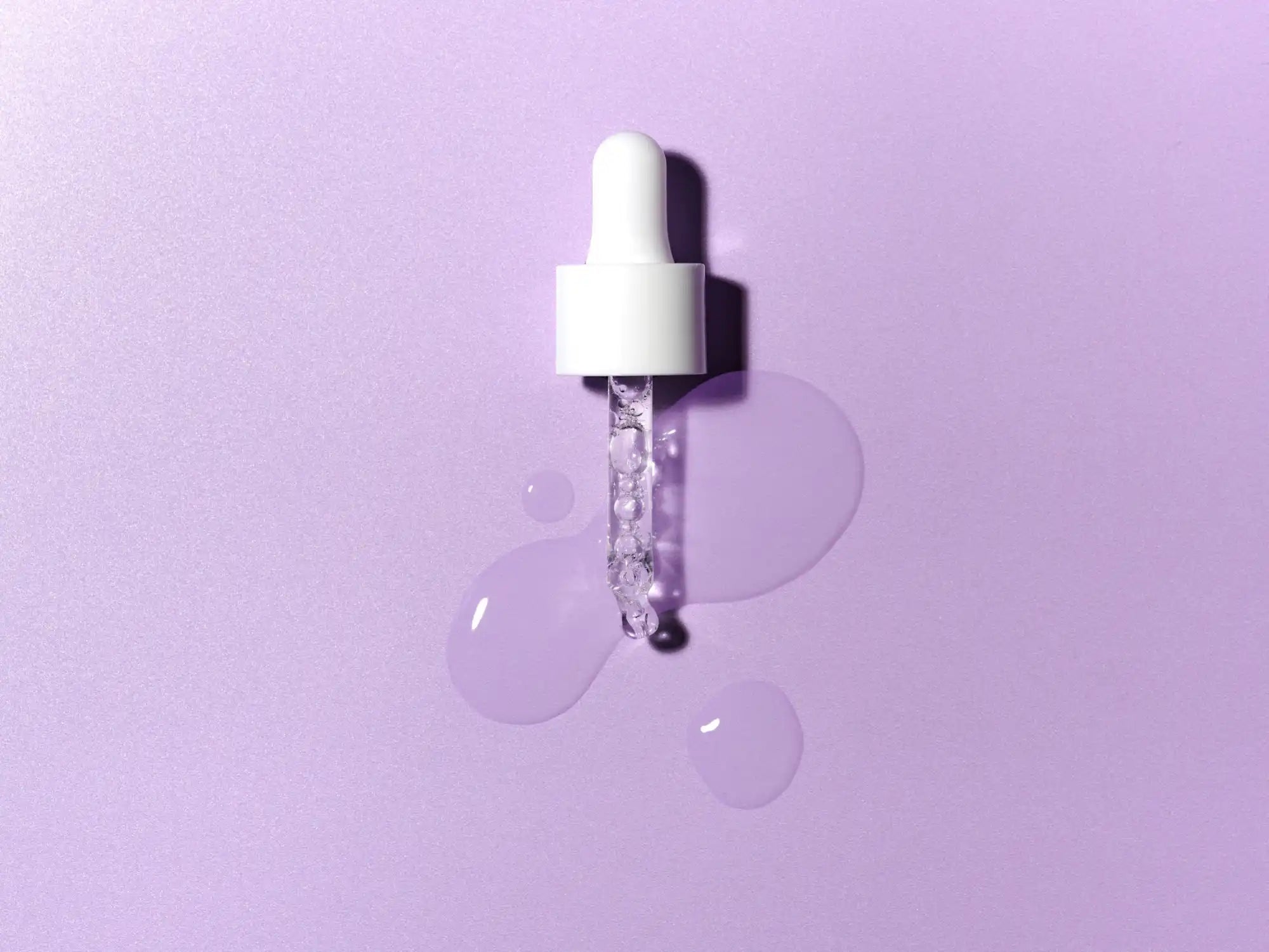 White dropper bottle with clear liquid